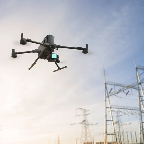 Professional drone flying outdoors against a blue sky